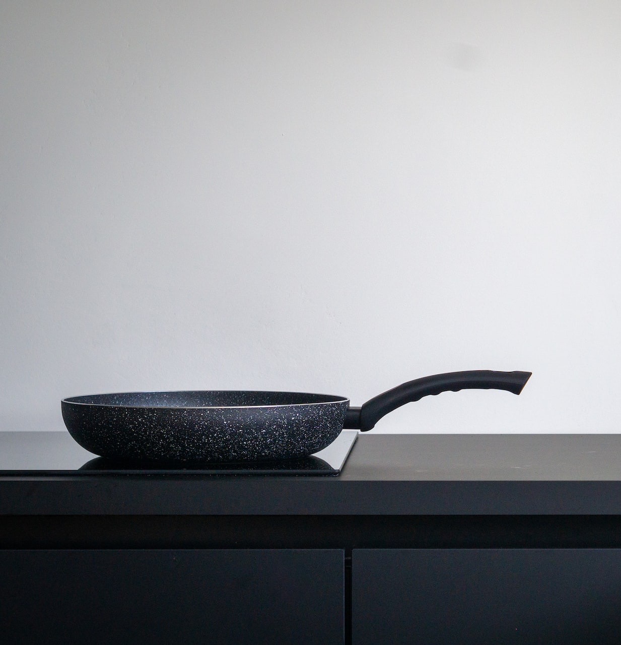 black leather chair on black wooden table